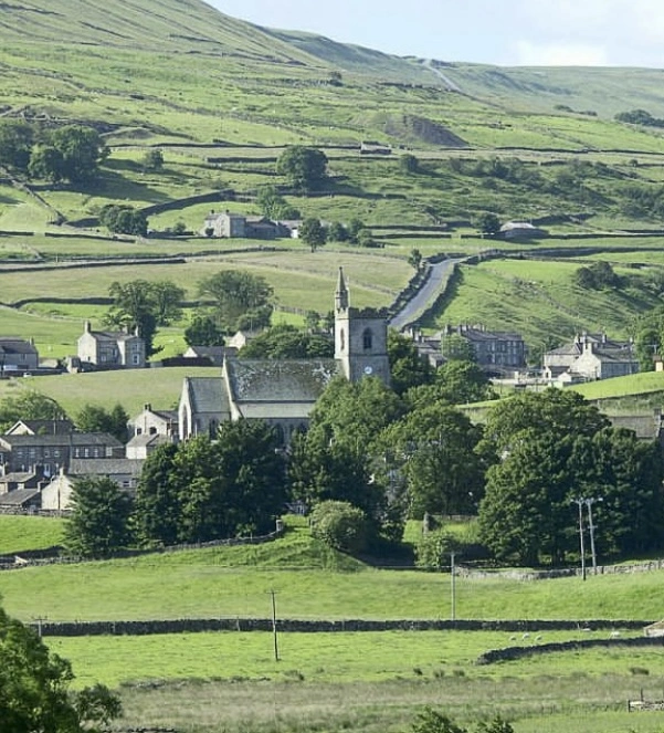 town of Hawes surrounded by fields and trees